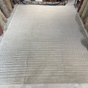 Contemporary ivory wool rug with allover concentric geometric pattern