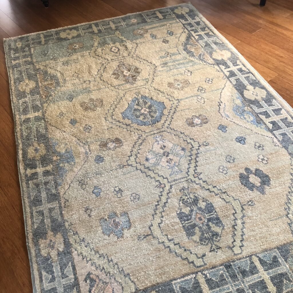A stunning contemporary Turkish Oushak rug, featuring a serene blend of beige, light blue, and dark blue. This modern interpretation of traditional Oushak designs brings warmth, elegance, and refined artistry to any space, 5'1" x 7'8" 