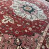 A modern Serapi rug handmade in Turkey featuring a bold floral medallion and an open, airy composition. A refined balance of tradition and modern elegance.