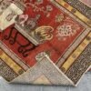 A richly detailed antique Khotan rug Samarkand vase design with a deep red field, intricate vase motifs, and a distinctive Chinese-inspired border. Bold, layered, and highly decorative, 4'0" x 8'6"