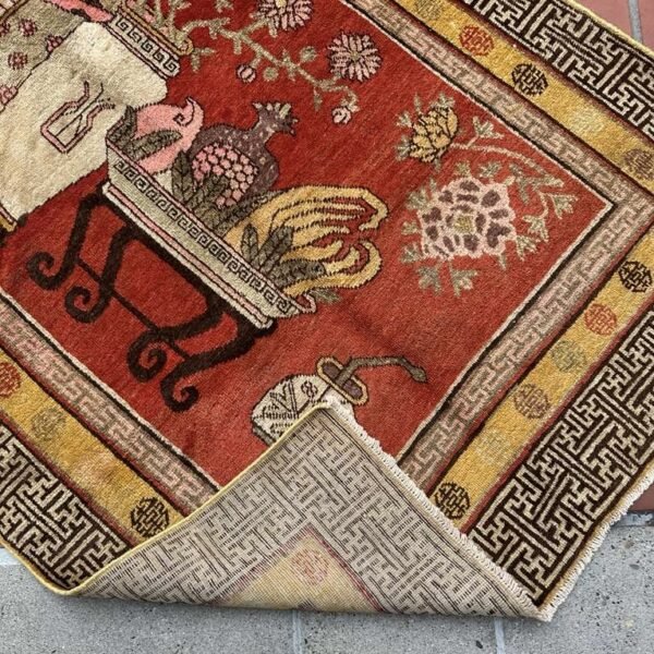 A richly detailed antique Khotan rug Samarkand vase design with a deep red field, intricate vase motifs, and a distinctive Chinese-inspired border. Bold, layered, and highly decorative, 4'0" x 8'6"