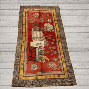 A richly detailed antique Khotan rug Samarkand vase design with a deep red field, intricate vase motifs, and a distinctive Chinese-inspired border. Bold, layered, and highly decorative, 4'0" x 8'6"