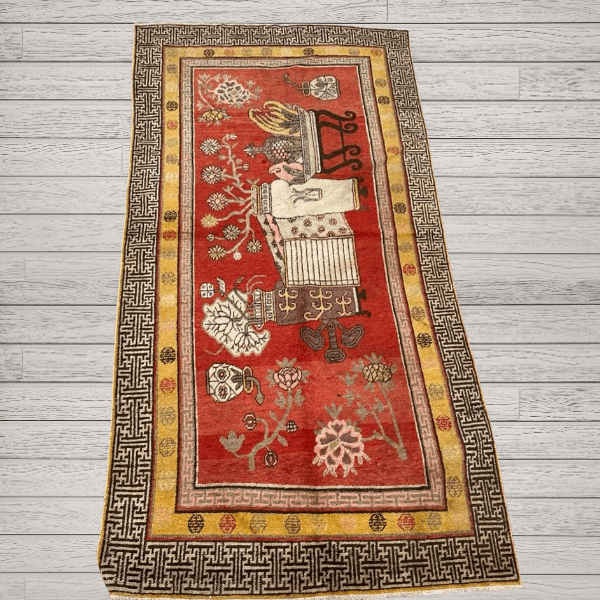 A richly detailed antique Khotan rug Samarkand vase design with a deep red field, intricate vase motifs, and a distinctive Chinese-inspired border. Bold, layered, and highly decorative, 4'0" x 8'6"