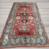 A character-rich antique Khotan rug with a deep red field and rare figurative table motifs. Layered, symbolic, and highly decorative, this piece offers both narrative and refined presence, 4'7" x 6'7"