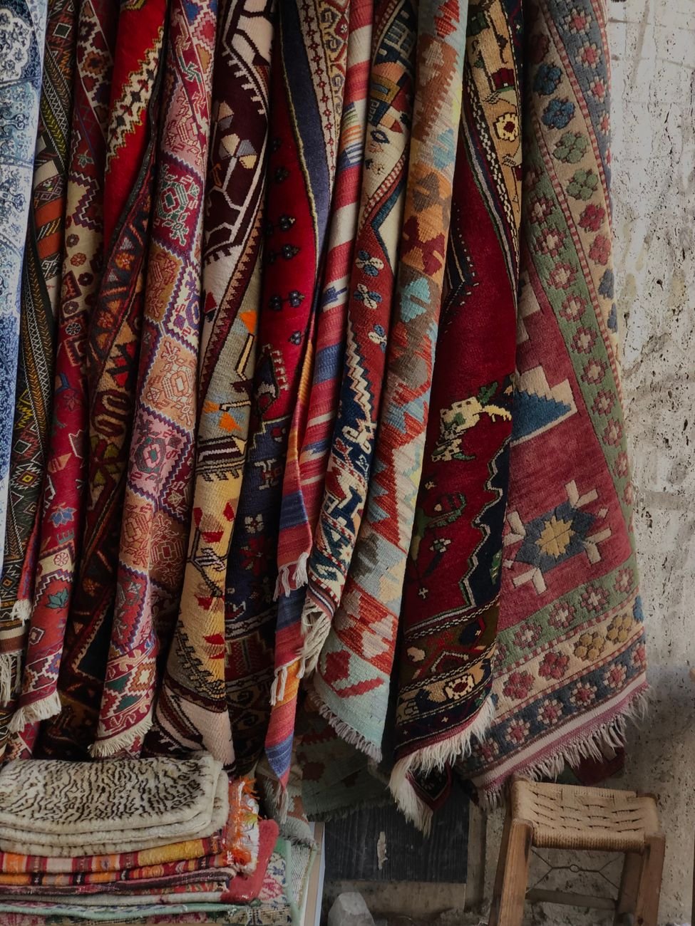 colorful traditional patterned rugs displayed indoors