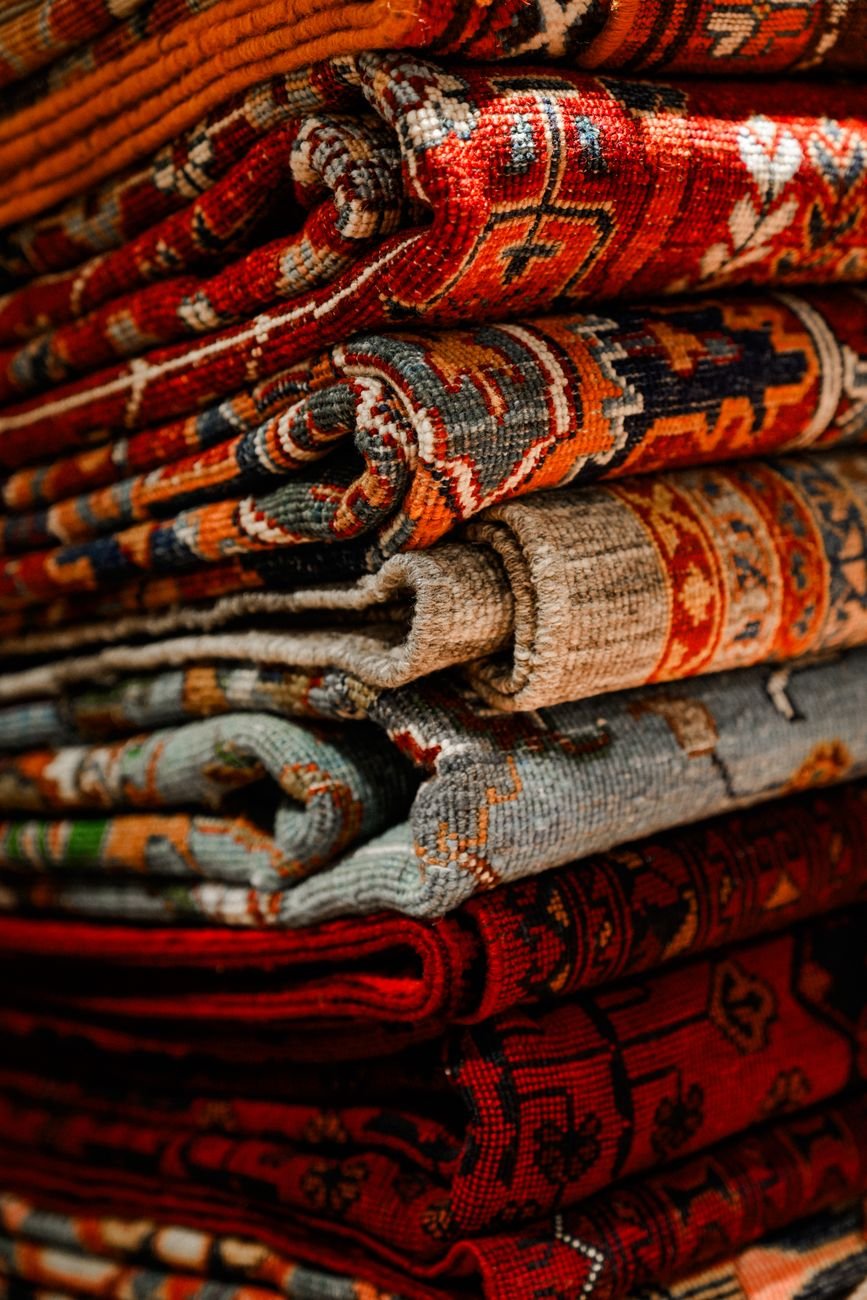 vibrant stacked persian rugs close up