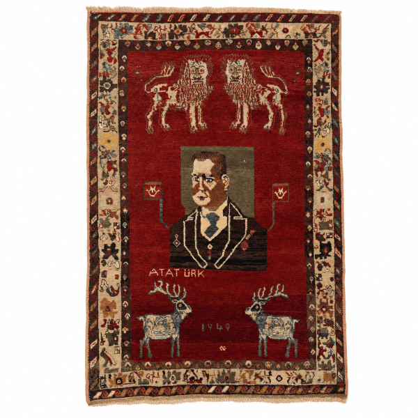 An exceptional and highly collectible pictorial vintage Turkish rug from Sivas, dated 1949, featuring a rare and symbolic figural composition centered around Mustafa Kemal Atatürk, the founder of modern Turkey.