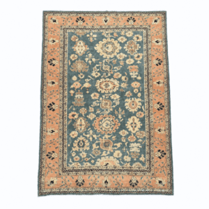 A beautifully balanced vintage Sultanabad-style rug featuring large-scale floral motifs on a soft green-blue field with a warm beige-peach border, 7'3" x 9'6"