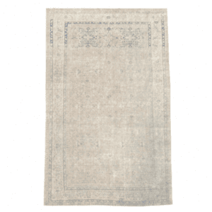 A softly antique washed rug from Sivas featuring delicate allover floral motifs in ivory and light blue. Elegant, understated, and timeless 6'4" x 9'6"