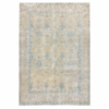 An elegant antique Tabriz rug with an ivory base and delicate blue floral motifs arranged in a refined allover design. The antique-washed finish has beautifully softened the palette, creating a light and understated appearance, 7'4" x 10'7"