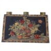 Vintage 1960s Chinese handmade tapestry in an Aubusson-inspired floral design, woven in wool on cotton. Features a colorful floral bouquet against a deep navy ground and an intricate floral border.