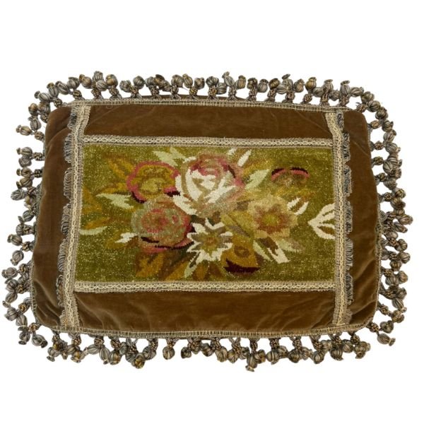 Savonnaire floral cushion cover A distinctive vintage French cushion cover featuring a decorative Savonnerie-style floral panel, framed by layered trims and finished with a full tassel fringe on all four sides.