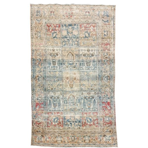 A distinctive antique botanical rug featuring an unusual tile-like composition filled with stylized botanical motifs. An ivory-beige ground is decorated with blue and red plants, trees, and flowers, beautifully softened by an antique wash, 4'3" x 6'5"